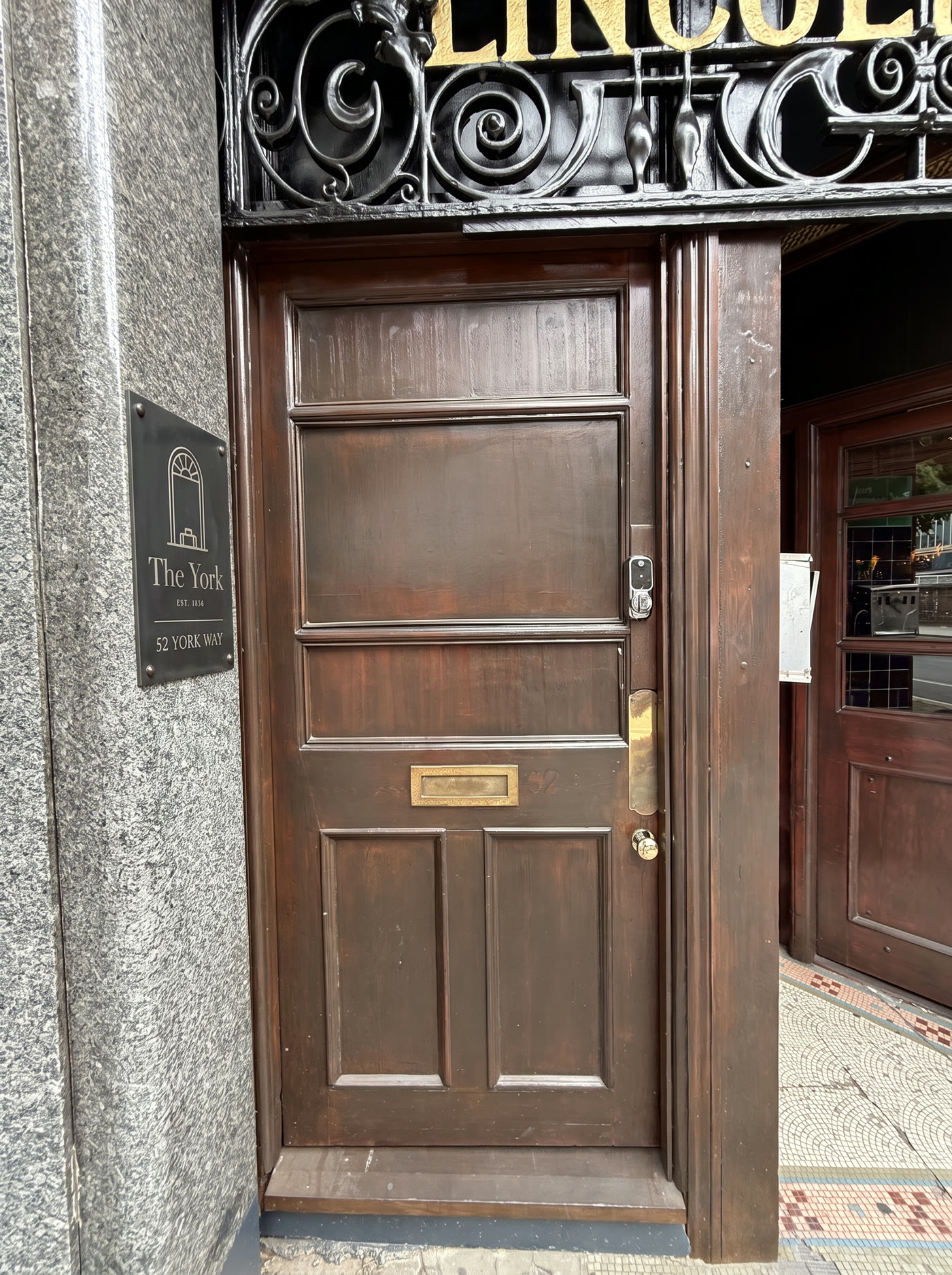 Dark bronze plate on the stone pillar
